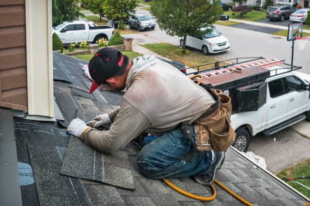 Professional Roofing technician working in Massapequa, NY